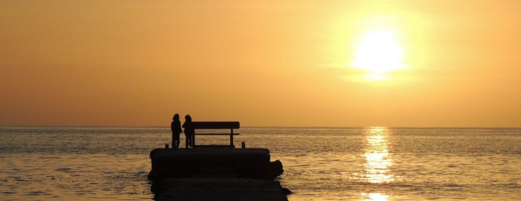 Arillas pier in the sunset